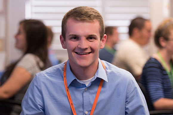 Employees work on developing a better curriculum for online students.
