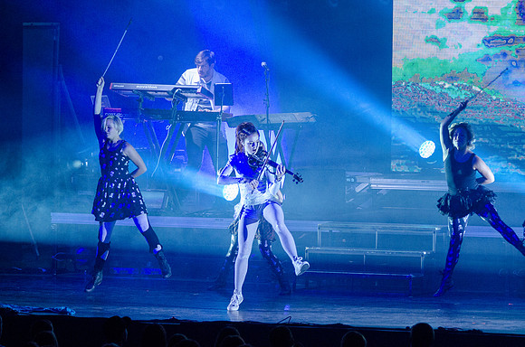 Lindsey Stirling at BYU-Idaho. A classically trained violinist from Gilbert, AZ, Lindsey has entered a futurist world of electronic big beats and animation, leaping through the music industry with ove