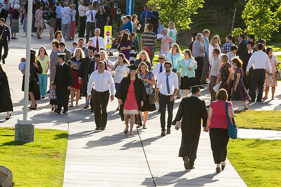 Graduates meet outside on the BYU-Idaho campus after commencement to take pictures before convocation starts.