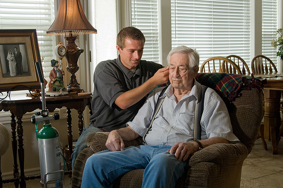 Casey Schanz, an intern with Teton Pharmacy works with elderly people in need of oxygen. Photos for an Internship brochere.  2007