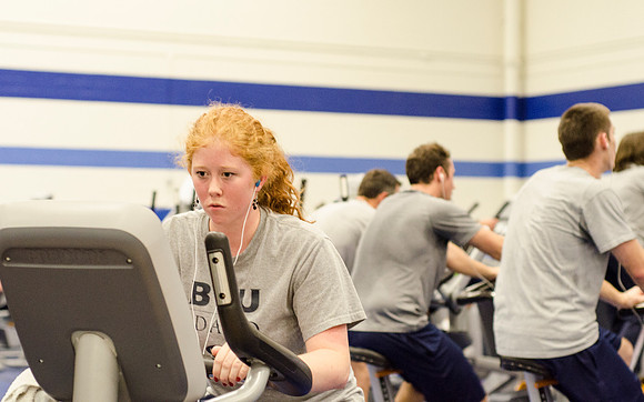 Students workout in the fitness center in the Hart building.