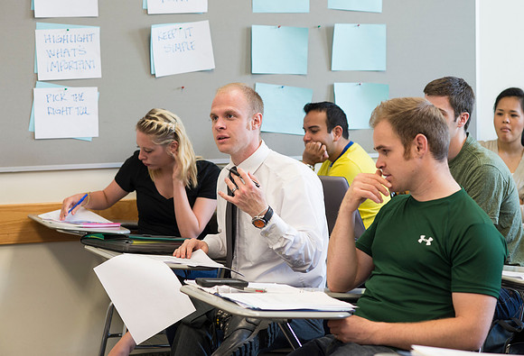 Sister Brooke McKenna teaches students in a communication class.