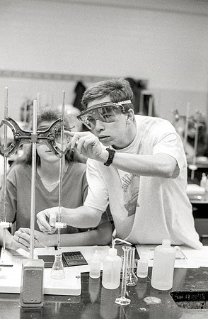 Students work diligently in the Chemistry Lab. December 1995.