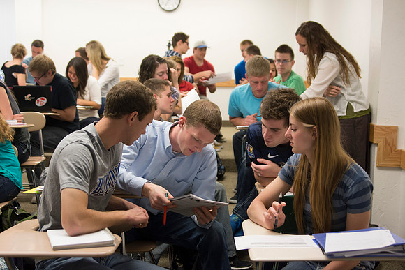 Students work on a group assignment in Sister Christensen's Essentials of Human Nutrition class during the 2014 Spring Semester.