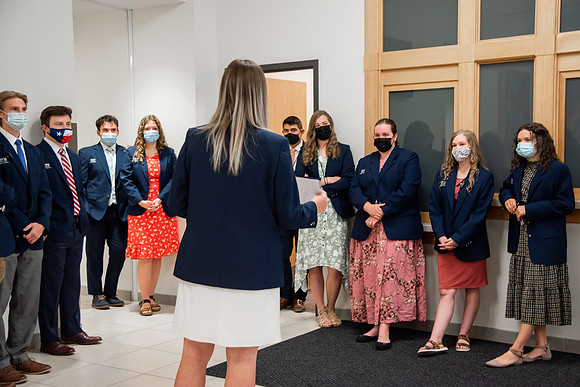 Ushers perform their duties in the I-Center to prepare for devotional. Used for an usher training video.