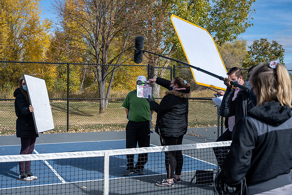 Dinking around playing pickleball for the HR Wellness Video.