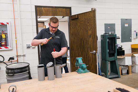 Civil engineering students work with different mixtures of cement to make a light, yet durable, cement that will be the building material for a canoe.