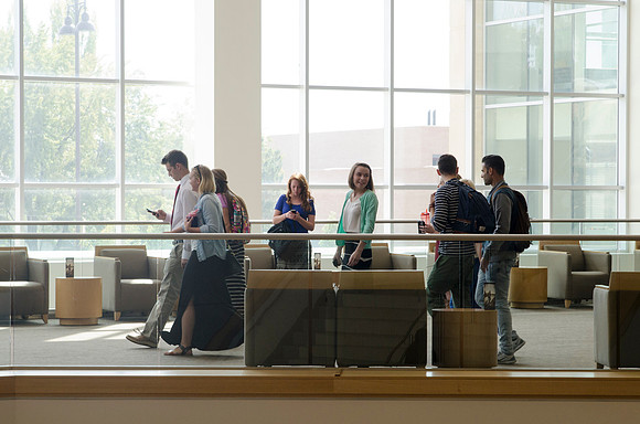 Students walking out on campus after devotional