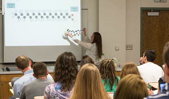 Sister Amanda Christensen talks to her Essentials of Human Nutrition class about Glycerides in the Clark Building during the 2014 Spring Semester.