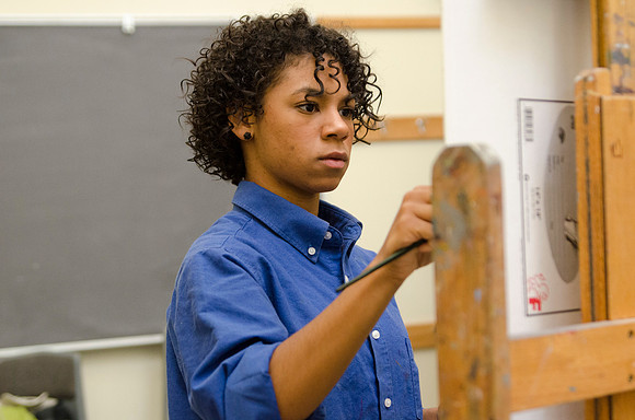 David Belka enthusiatically teaches painting principles to beginning painting class.