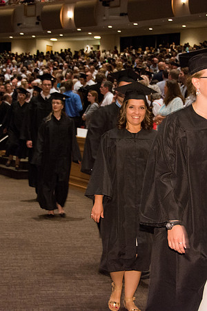 BYU-Idaho graduates walk in to the commencement ceremony, held in the BYU-Idaho Center.