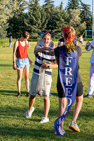 Students gather at the upper field for various 4th of July activities.