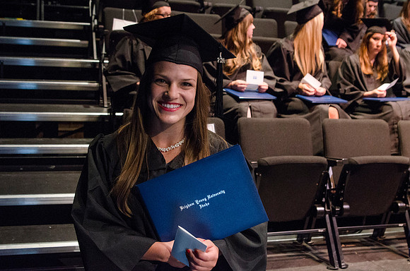 Dean's of the College of Performing and Visual Arts award diplomas to graduates during convocation held in the Snow Building.