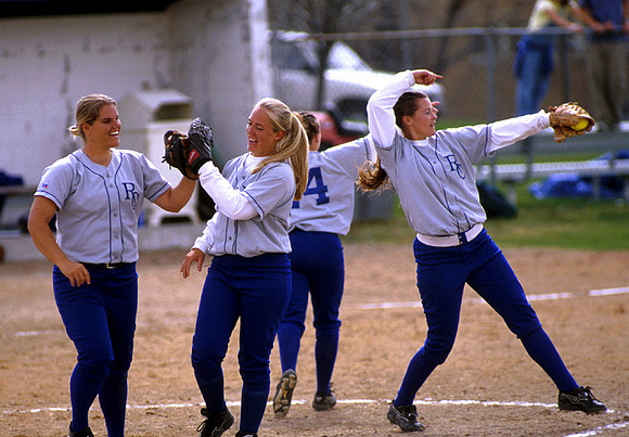 Softball players do a little mit slapping when taking the field.