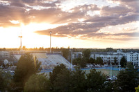 People at the Stadium during sunset for a football game