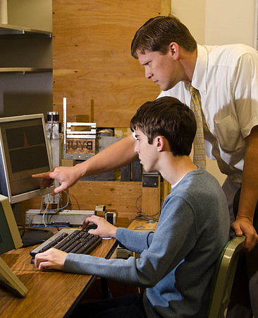 Instructor Evan Hansen and student Dallin Pincock in the Physics Dept. work with the Positron Annihilation Spectroscopy.