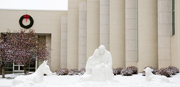 Light snow was faling around the Nativity Decorations outside the Taylor Building.