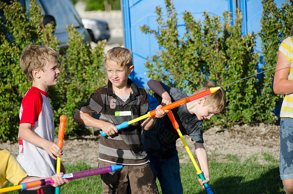 Online instructors gather with their families for an eveing of BBQ and games.