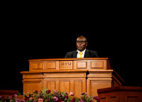 Elder Egbo speaking to students in the BYUI Center.