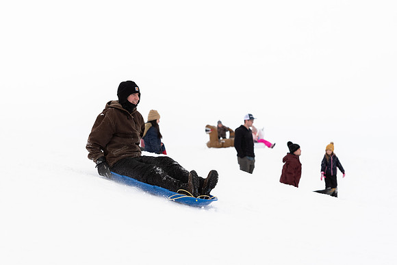 Volunteers and Community members enjoying Winter Fest at the Teton Lakes Golf Course.