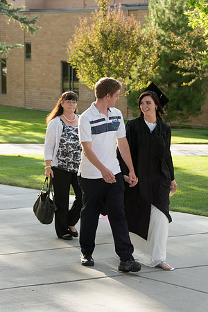 Faculty, family and graduates around campus after the commencement ceremony.