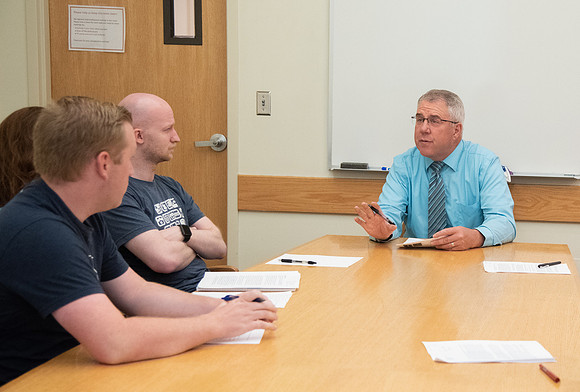 Instructor Brent Bean teaching Communication class.