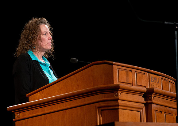 Sister Heather Hall giving a talk during devotional.
