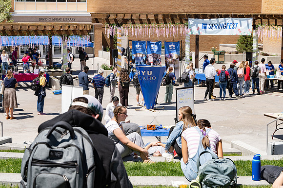 Spirit Fest Booths on campus, students talking and having fun together.