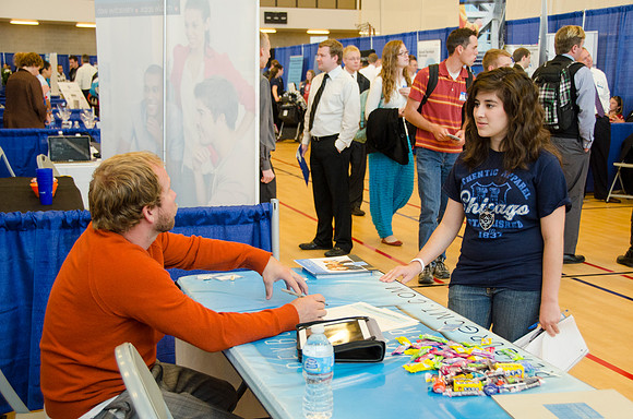 BYU-Idaho students speak to representatives from colleges or companies from their field of study at a career fair held in the I-Center gym