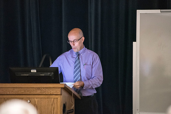 Jason Flora speaks at the faculty conference.