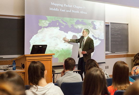 Brother Michael Madsen teaches his early morning Geography For Elementary Teachers class in the Ricks Building.