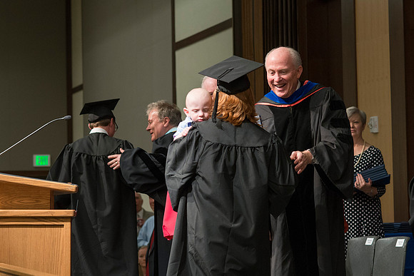 Elder Maynes congratulates the graduates in the College of Language and Letters Convocation in the Manwaring Center Ballroom. BYU-Idaho photo by Michael Lewis
