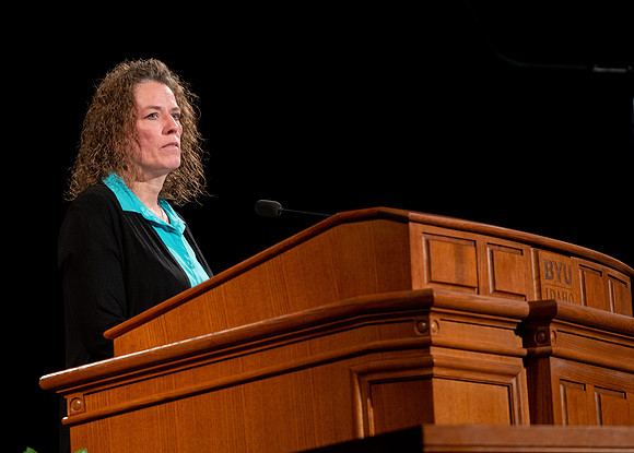 Sister Heather Hall giving a talk during devotional.