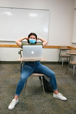 Examples of students staying safe and healthy during the COVID-19 pandemic by social distancing, following pathway arrows, and wearing face masks.