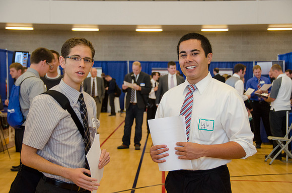 BYU-Idaho students speak to one another at a career fair held in the I-Center gym