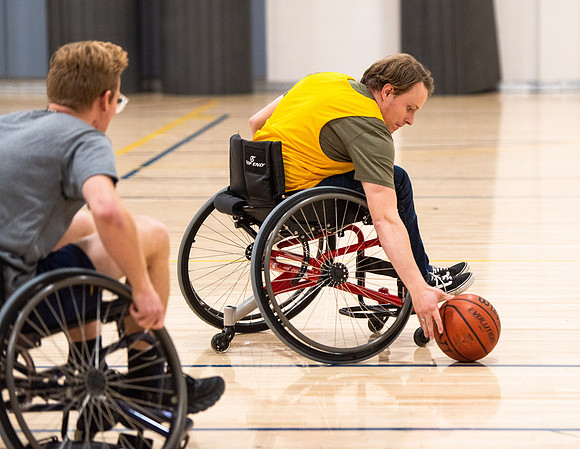 Students participate of Wheelchair Basketball in the Hart Gym.