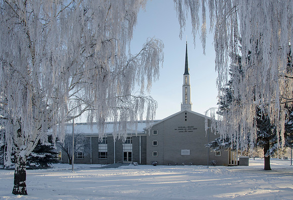 The Church of Jesus Christ of Latter Day Saints old gray church house in Sugar City, Idaho on a frosty winter day.