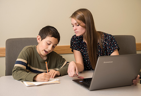Teacher Education students offer their services tutoring kids 3rd grade to 12th grade. Hannah Paget tutoring Jaden Davis.