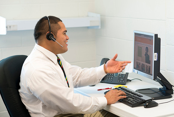 Students help take calls in the Pathway Support Center.