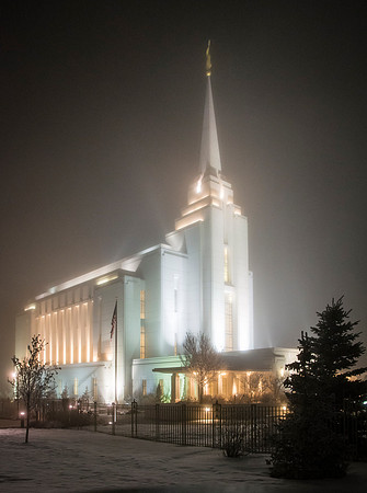 Rexburg Temple lights cut through the fog on a cold winter night.