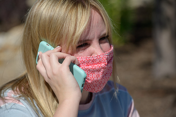 Student volunteers show the way to stay safe during this COVID 19 pandemic by social distancing, following pathway arrows and proper wearing of masks .