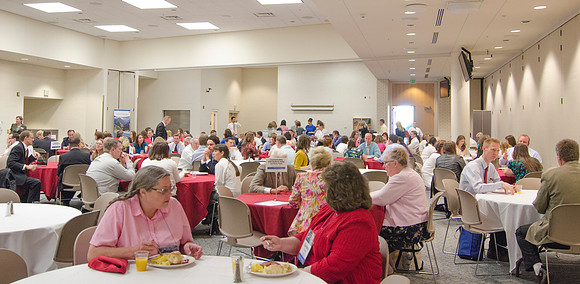 Online instructors gather for breakfast and instruction.