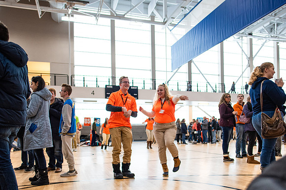 Freshmen students meet their new I-Team groups in the BYU-Idaho Center courts.