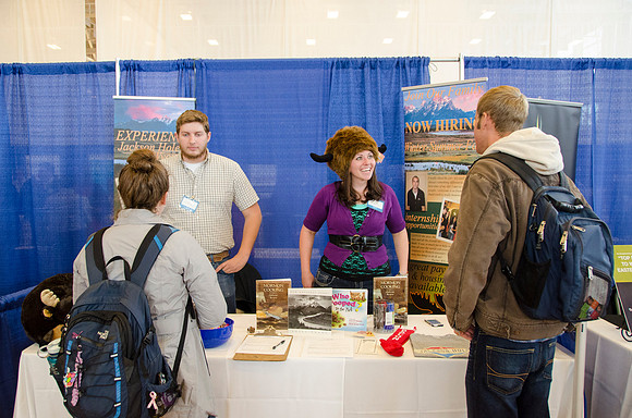 BYU-Idaho students speak to representatives from colleges or companies from their field of study at a career fair held in the I-Center gym