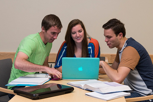 Students engage in an active study group for the new housing promo pictures.