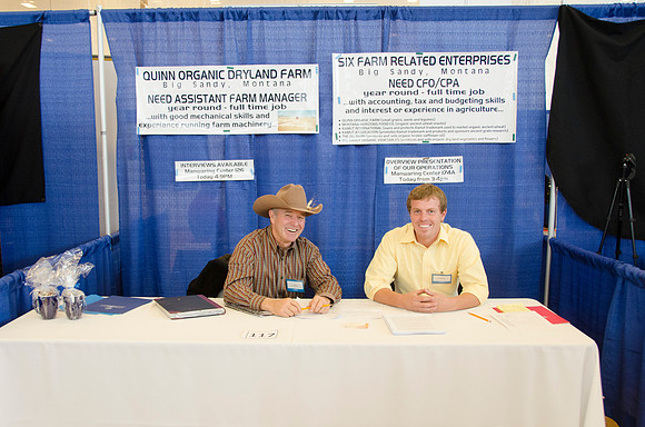Representatives from Quinn Farms pose for the camera at a career fair held in the BYU-Idaho Center gym