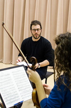 A member of the Shanghai String Quartet working with student ensembles.
