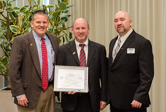 Todd Smith receiving an award on behalf of BYU-Idaho from the Office of the Secretary of Defense for the support BYU-Idaho has given to Peter Stilling while he has been serving in the Guard. Awarded b