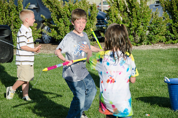 Online instructors gather with their families for an eveing of BBQ and games.