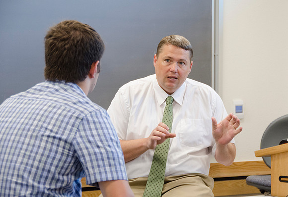 Matt Miles consults with a student one on one.